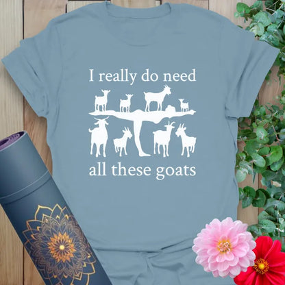 Muted stone blue yoga t-shirt featuring whimsical goat design and mindful humor perfect for free-spirited living.