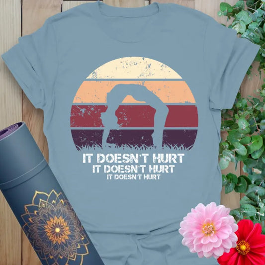 Muted stone blue yoga t-shirt showcasing colorful retro yoga humor design inspiring laughter and soulful flow.