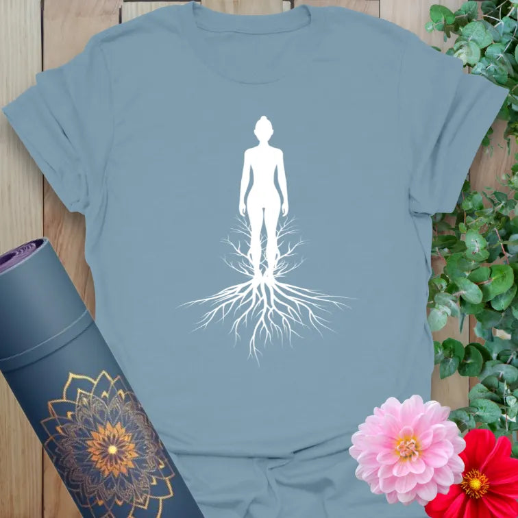 Muted stone blue yoga t-shirt with serene rooted figure artwork celebrating grounded living and soulful expansion.

