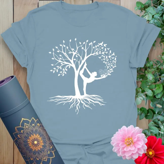 Muted stone blue yoga t-shirt with soulful Tree Pose and flourishing tree design symbolizing grounded inspiration and mindful living.