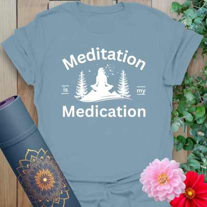 Muted stone blue yoga t-shirt with yogi and nature design symbolizing peaceful healing through mindful meditation.