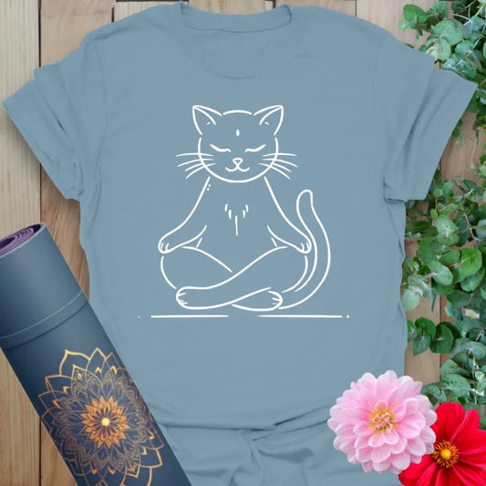 Muted stone blue yoga t-shirt with peaceful meditating cat artwork symbolizing light-hearted serenity and soulful mindfulness.