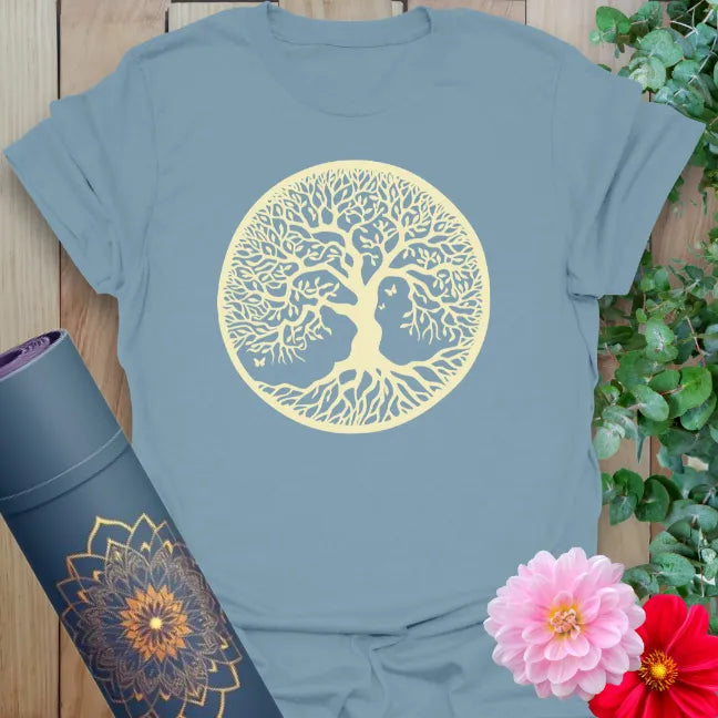 Muted stone blue yoga t-shirt with sacred Tree of Life circle design inspiring grounded strength and mindful, conscious evolution.