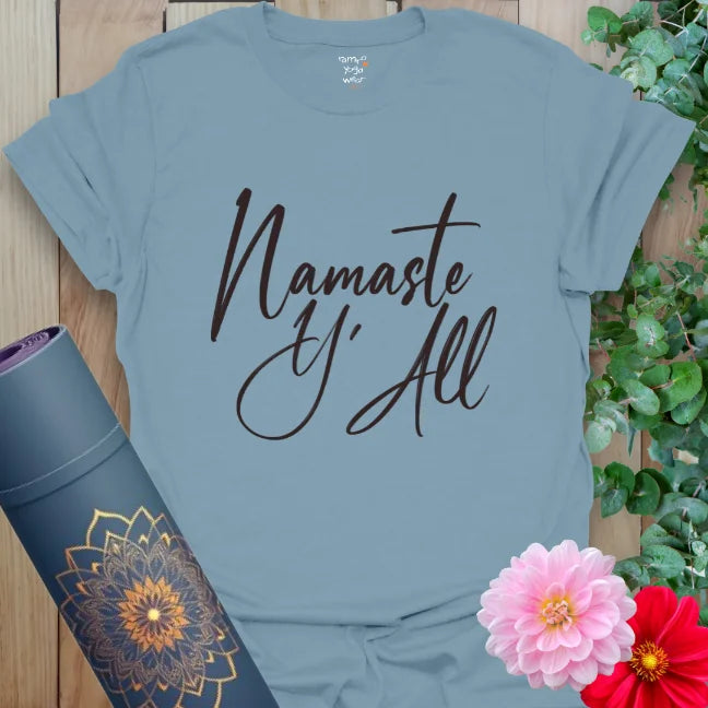 Stone Blue tee with dark script saying “Namaste Y’All.” Southern energy meets yoga grounding.