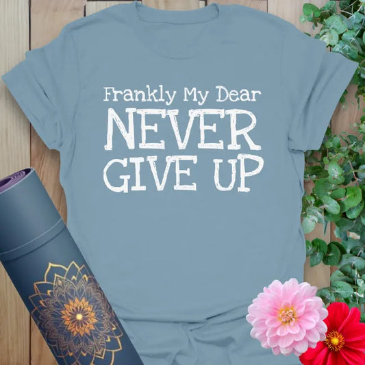 Muted stone blue yoga t-shirt with empowering message inspiring soulful resilience, heart-centered action, and conscious living.