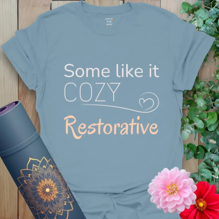 Stone Blue yoga shirt reading “Some Like It Cozy – Restorative.” Designed for breathwork, slow flow, or savasana ease.