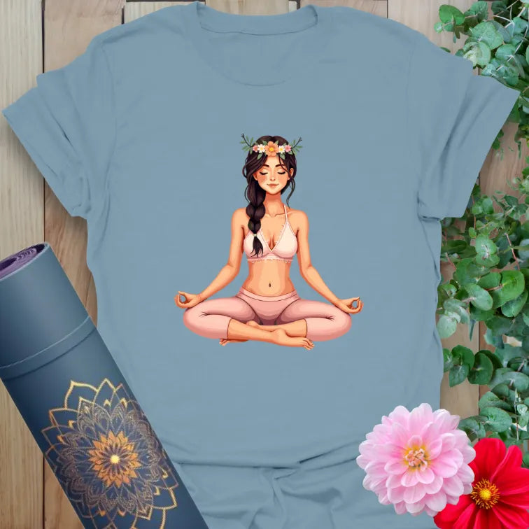 Muted stone blue yoga t-shirt with floral-crowned yogi artwork symbolizing serenity, strength, and heart-led mindful energy.