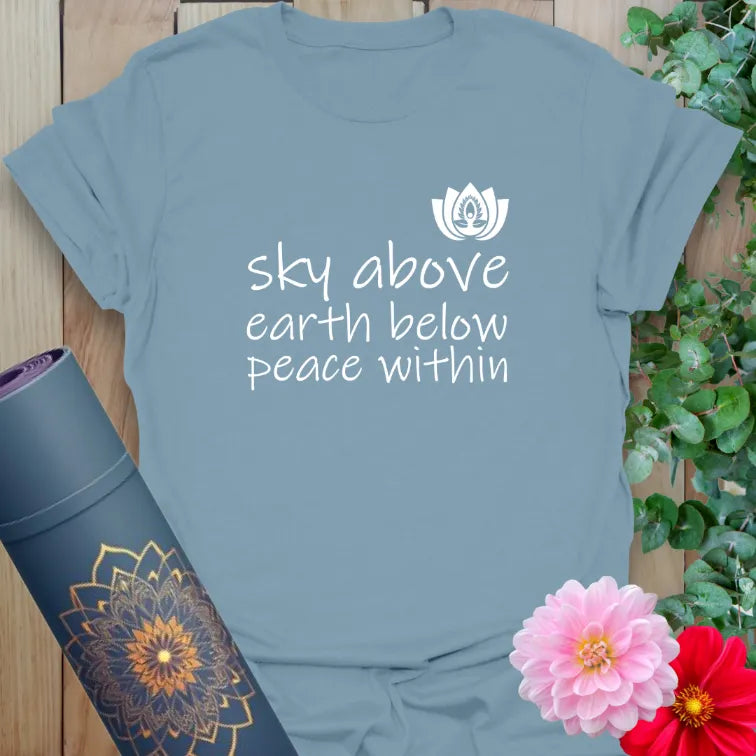 Muted stone blue yoga t-shirt with nature-inspired mindfulness quote and lotus bloom for calm, grounded, soulful living.