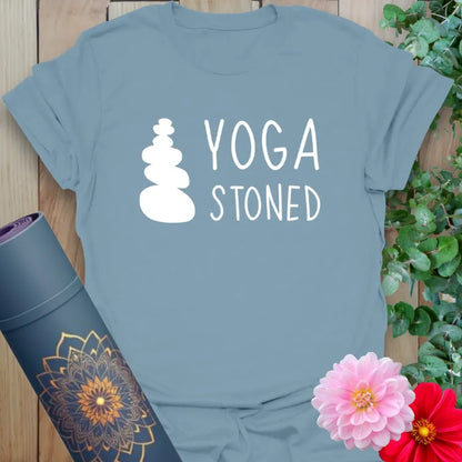 Muted stone blue yoga t-shirt featuring simple stacked stone art and playful lettering for joyful, mindful wear.
