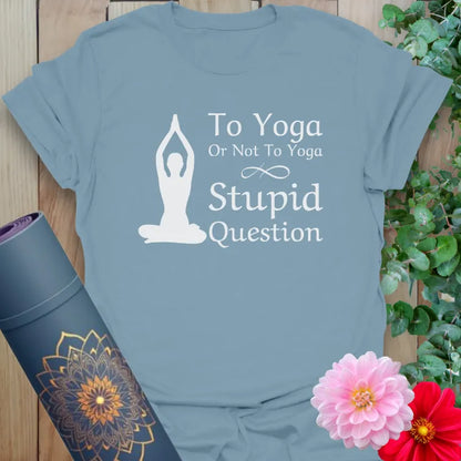 Muted stone blue yoga tee with humorous “Stupid Question” quote and yoga pose graphic for cheerful mindful living.