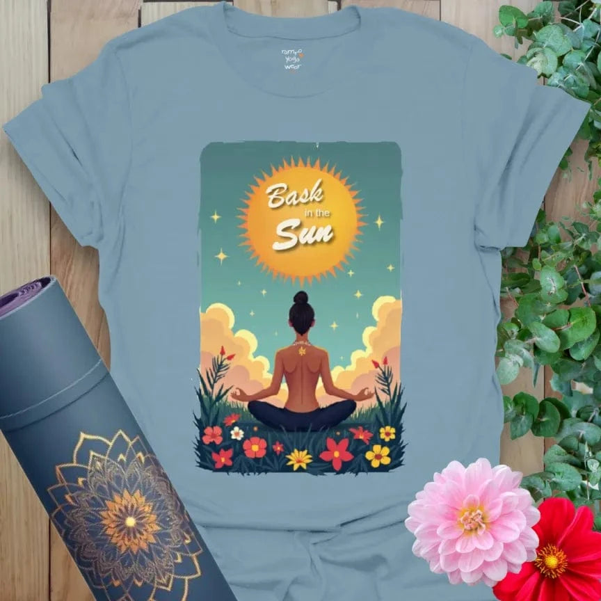 Muted stone blue yoga tee showcasing sunrise energy, peaceful nature scene, and empowering message for mindful daily wear.