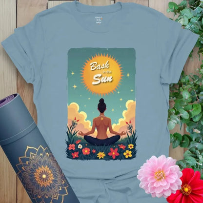 Muted stone blue yoga tee showcasing sunrise energy, peaceful nature scene, and empowering message for mindful daily wear.