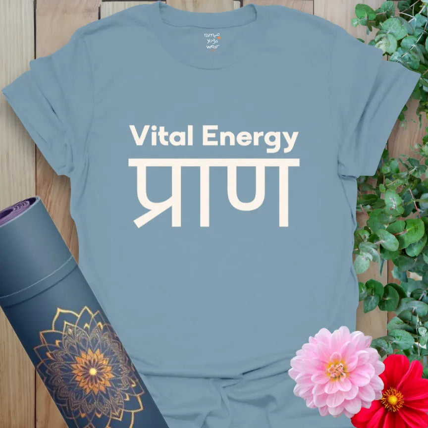 Stone Blue T-shirt with white “Vital Energy” and Sanskrit “प्राण” design. Soothing yet powerful, inspired by breath and movement.