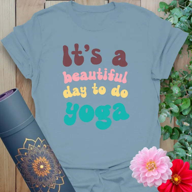 Muted stone blue t-shirt with uplifting yoga quote in vintage font for joyful, stylish yoga lovers.
