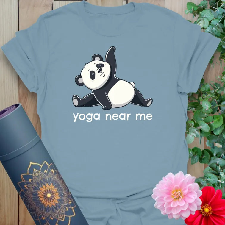Muted stone blue yoga t-shirt with adorable panda pose and “yoga near me” graphic for joyful yogis.