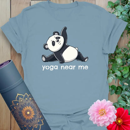 Muted stone blue yoga t-shirt with adorable panda pose and “yoga near me” graphic for joyful yogis.
