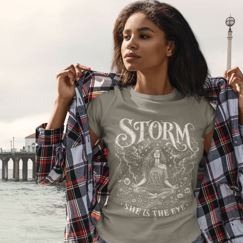 Ramro Yoga Wear Storm tee in Heather Military Green — she is the eye storm meditation design, coastal pier lifestyle shot