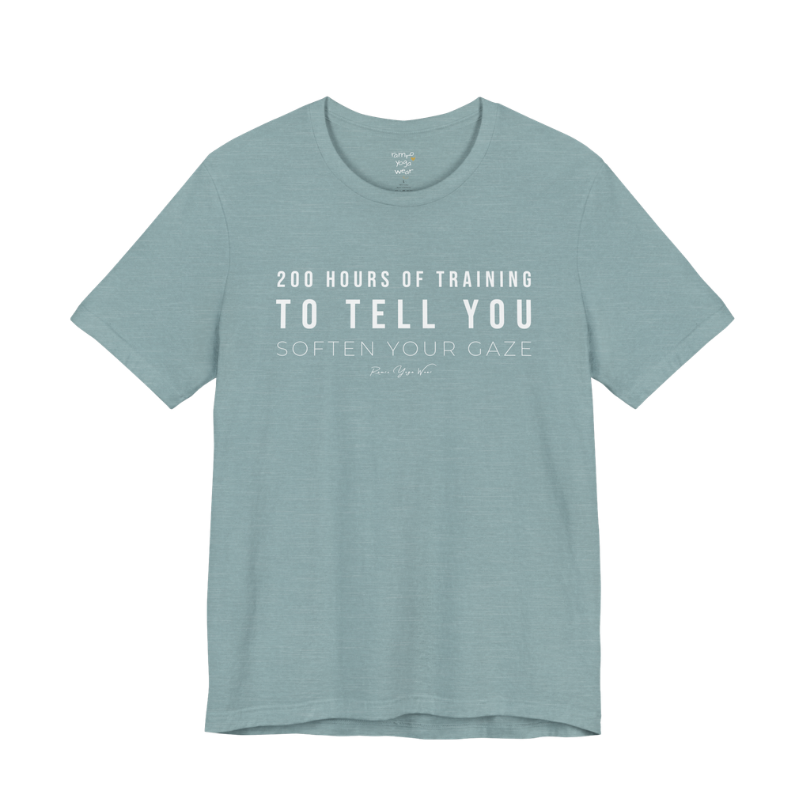 200 HOURS OF TRAINING TO TELL YOU SOFTEN YOUR GAZE yoga teacher gift tee flat lay in Heather Blue Lagoon — Yoga Teacher Gifts collection by Ramro Yoga Wear