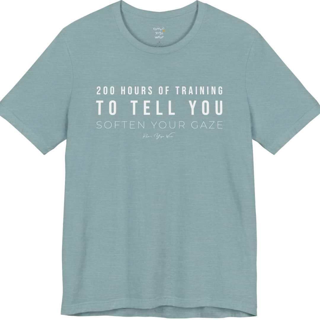 200 HOURS OF TRAINING TO TELL YOU SOFTEN YOUR GAZE yoga teacher gift tee flat lay in Heather Blue Lagoon — Yoga Teacher Gifts collection by Ramro Yoga Wear