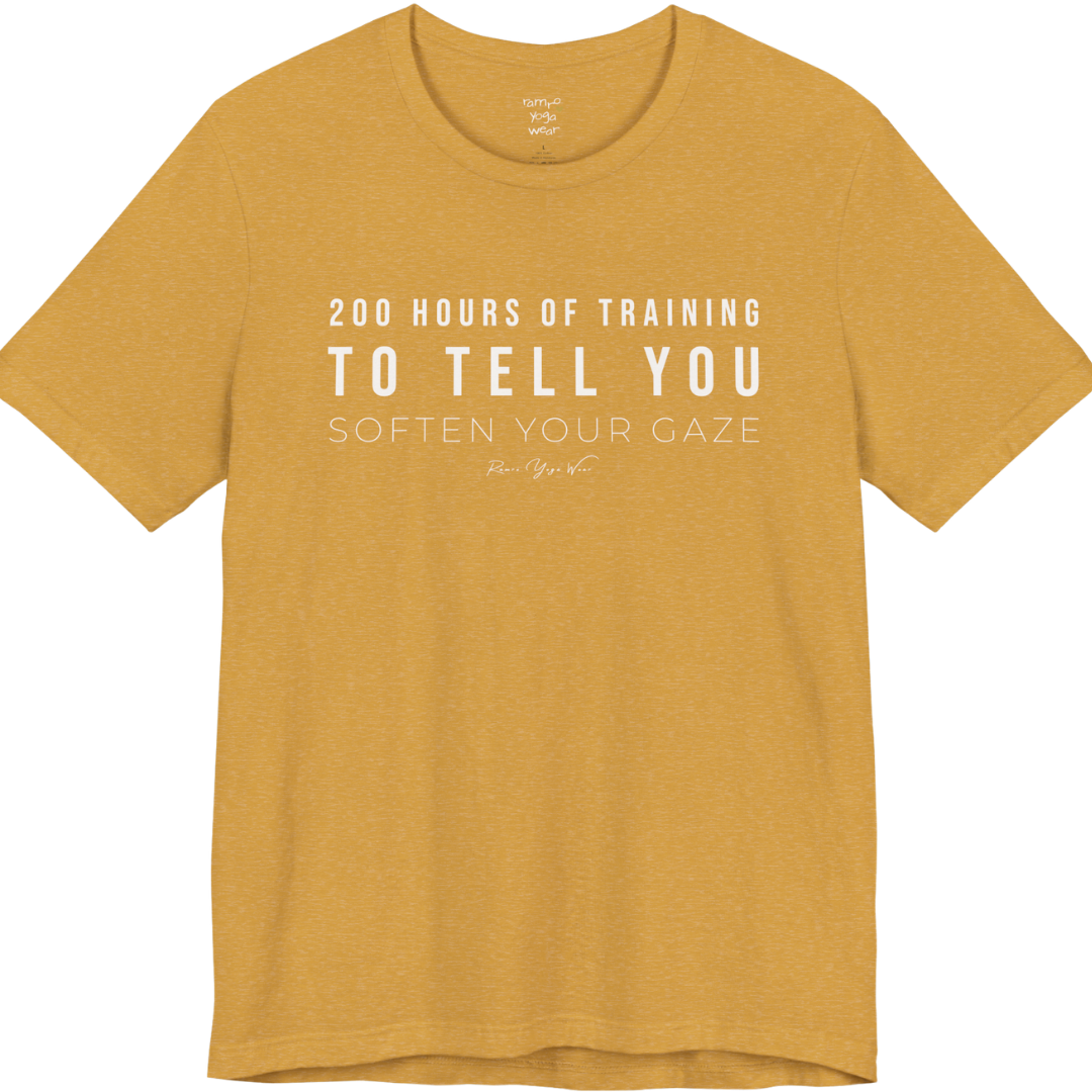 200 HOURS OF TRAINING TO TELL YOU SOFTEN YOUR GAZE yoga teacher gift tee flat lay in Heather Mustard — Yoga Teacher Gifts collection by Ramro Yoga Wear