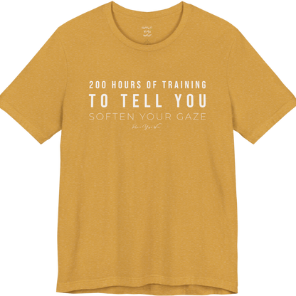 200 HOURS OF TRAINING TO TELL YOU SOFTEN YOUR GAZE yoga teacher gift tee flat lay in Heather Mustard — Yoga Teacher Gifts collection by Ramro Yoga Wear