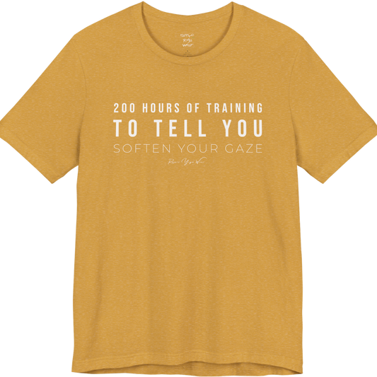 200 HOURS OF TRAINING TO TELL YOU SOFTEN YOUR GAZE yoga teacher gift tee flat lay in Heather Mustard — Yoga Teacher Gifts collection by Ramro Yoga Wear