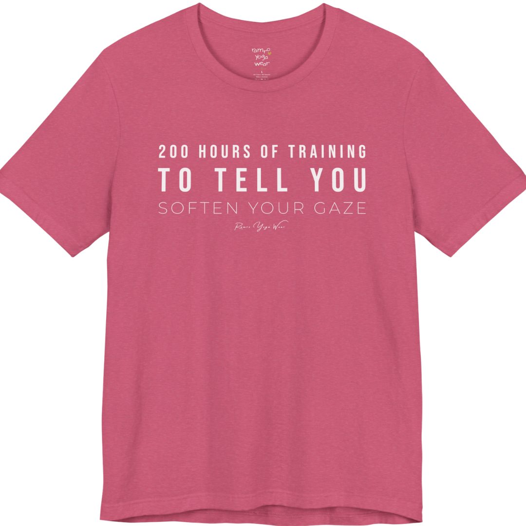 200 HOURS OF TRAINING TO TELL YOU SOFTEN YOUR GAZE yoga teacher gift tee flat lay in Heather Raspberry — Yoga Teacher Gifts collection by Ramro Yoga Wear