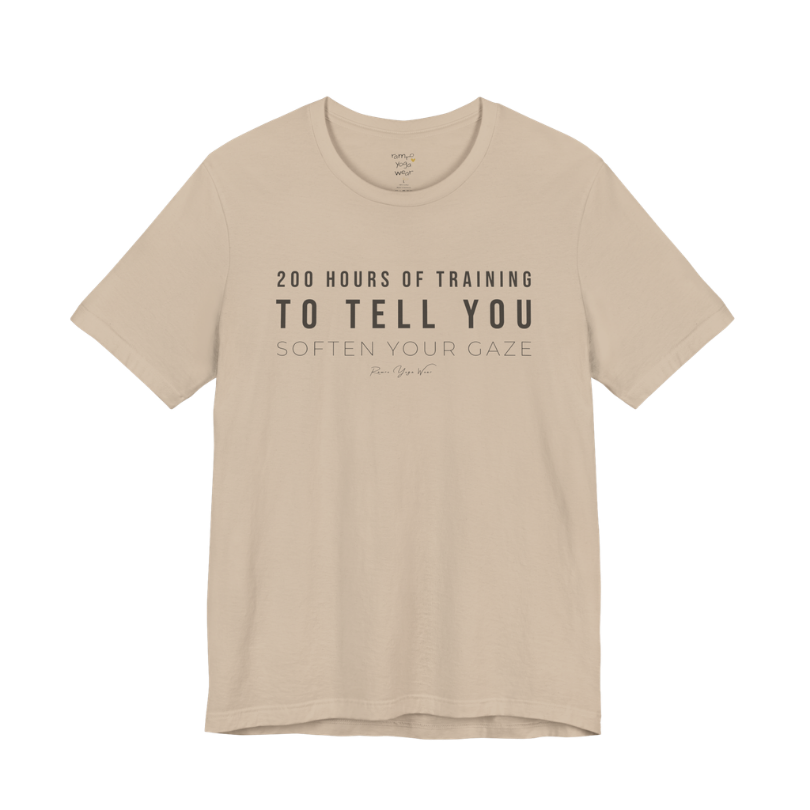 200 HOURS OF TRAINING TO TELL YOU SOFTEN YOUR GAZE yoga teacher gift tee flat lay in Tan — Yoga Teacher Gifts collection by Ramro Yoga Wear