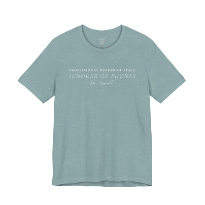 PROFESSIONAL HOLDER OF SPACE IGNORER OF PHONES yoga teacher gift tee flat lay in Heather Blue Lagoon — Yoga Teacher Gifts collection by Ramro Yoga Wear