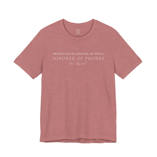 PROFESSIONAL HOLDER OF SPACE IGNORER OF PHONES yoga teacher gift tee flat lay in Heather Mauve — Yoga Teacher Gifts collection by Ramro Yoga Wear
