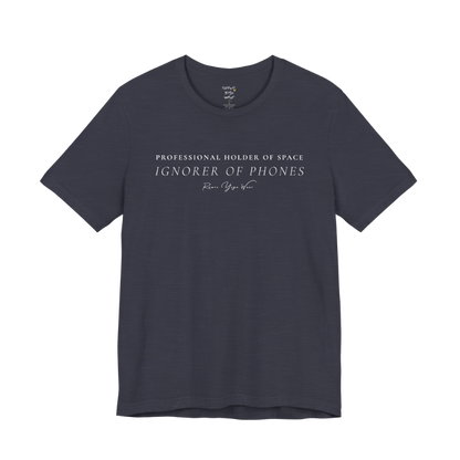 PROFESSIONAL HOLDER OF SPACE IGNORER OF PHONES yoga teacher gift tee flat lay in Heather Midnight Navy — Yoga Teacher Gifts collection by Ramro Yoga Wear