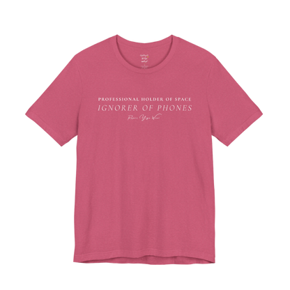 PROFESSIONAL HOLDER OF SPACE IGNORER OF PHONES yoga teacher gift tee flat lay in Heather Raspberry — Yoga Teacher Gifts collection by Ramro Yoga Wear
