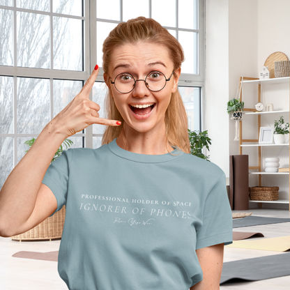 Woman wearing Sub Heather Blue Lagoon yoga teacher gift tee making a call-me gesture in a home studio — Yoga Teacher Gifts collection by Ramro Yoga Wear