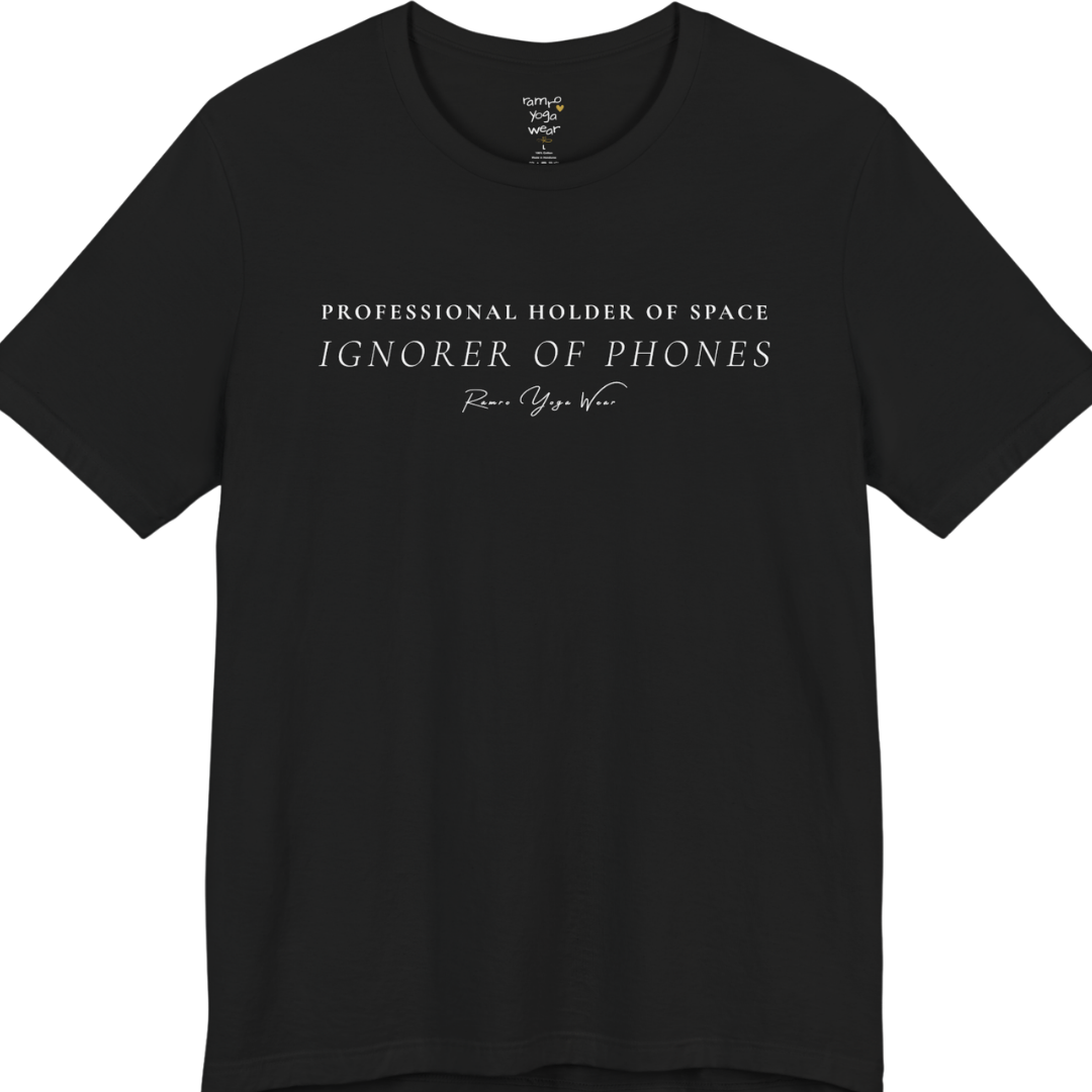 PROFESSIONAL HOLDER OF SPACE IGNORER OF PHONES yoga teacher gift tee flat lay in Black — Yoga Teacher Gifts collection by Ramro Yoga Wear