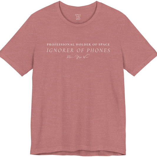 PROFESSIONAL HOLDER OF SPACE IGNORER OF PHONES yoga teacher gift tee flat lay in Heather Mauve — Yoga Teacher Gifts collection by Ramro Yoga Wear