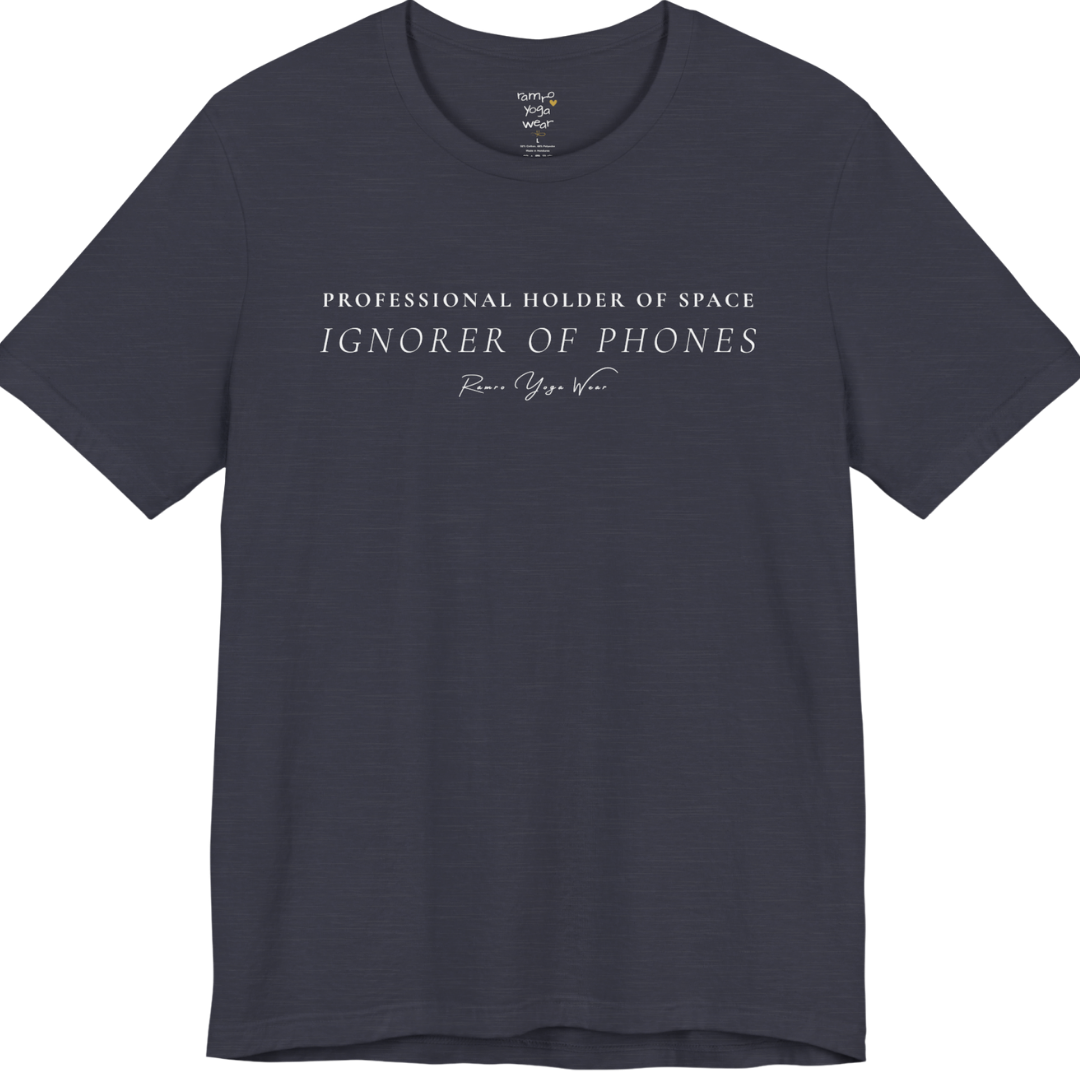 PROFESSIONAL HOLDER OF SPACE IGNORER OF PHONES yoga teacher gift tee flat lay in Heather Midnight Navy — Yoga Teacher Gifts collection by Ramro Yoga Wear