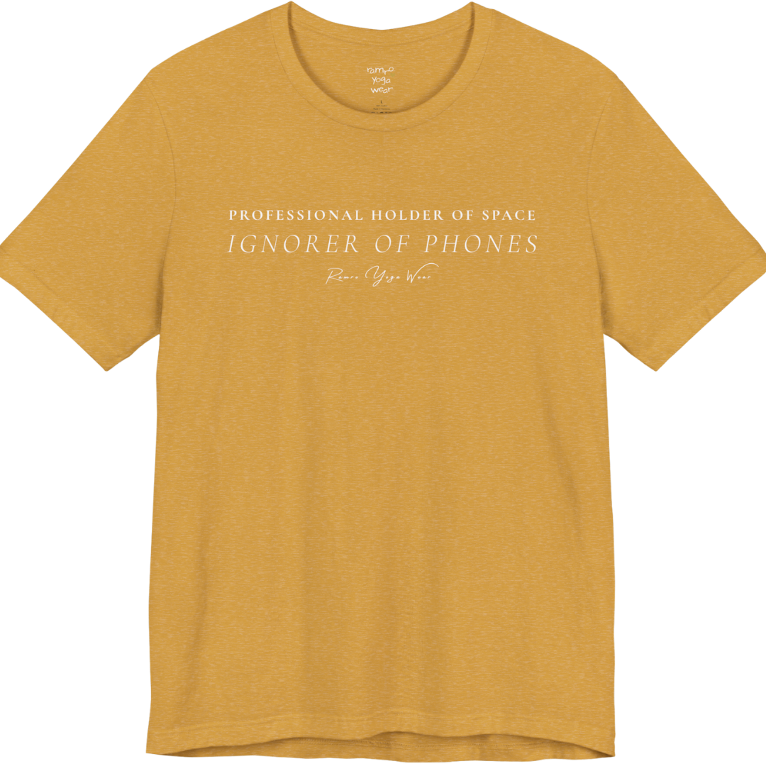PROFESSIONAL HOLDER OF SPACE IGNORER OF PHONES yoga teacher gift tee flat lay in Heather Mustard — Yoga Teacher Gifts collection by Ramro Yoga Wear
