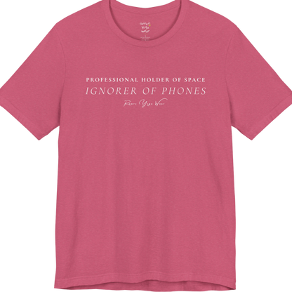 PROFESSIONAL HOLDER OF SPACE IGNORER OF PHONES yoga teacher gift tee flat lay in Heather Raspberry — Yoga Teacher Gifts collection by Ramro Yoga Wear