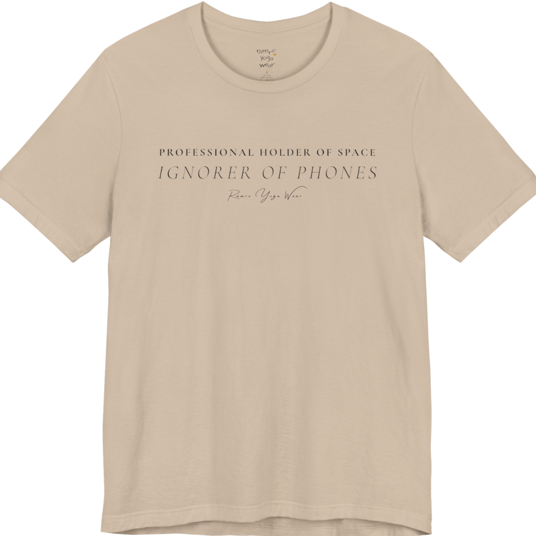 PROFESSIONAL HOLDER OF SPACE IGNORER OF PHONES yoga teacher gift tee flat lay in Tan  — Yoga Teacher Gifts collection by Ramro Yoga Wear