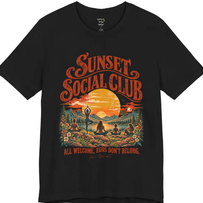A short sleeved tee called the Sunset T-Shirt, flat lay and a Bella + Canvas 3001 shirt. Simply says, Sunset Social Club, All Welcome, Egos Don't Belong. Design highlights several people meditating together across a mountain landscape at sunset, with a large setting sun, pine trees, and florals, in a color vintage travel-poster illustration. Color is Black.