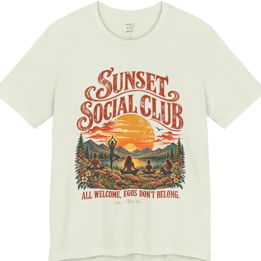 A short sleeved tee called the Sunset T-Shirt, flat lay and a Bella + Canvas 3001 shirt. Simply says, Sunset Social Club, All Welcome, Egos Don't Belong. Design highlights several people meditating together across a mountain landscape at sunset, with a large setting sun, pine trees, and florals, in a color vintage travel-poster illustration. Color is Citron.