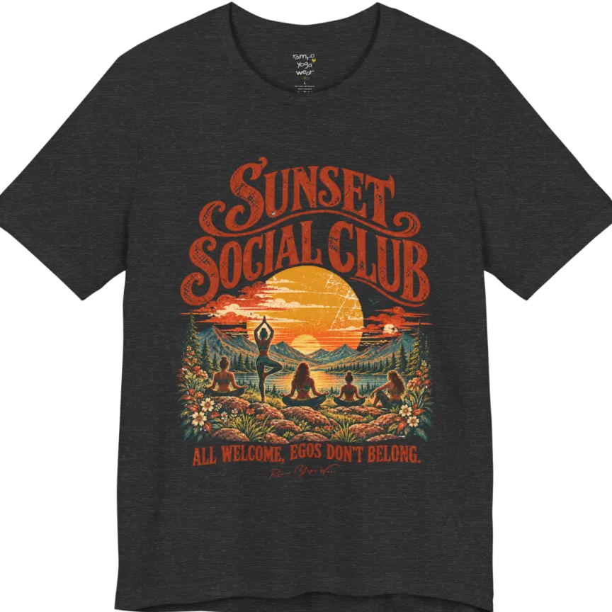 A short sleeved tee called the Sunset T-Shirt, flat lay and a Bella + Canvas 3001 shirt. Simply says, Sunset Social Club, All Welcome, Egos Don't Belong. Design highlights several people meditating together across a mountain landscape at sunset, with a large setting sun, pine trees, and florals, in a color vintage travel-poster illustration. Color is Dark Grey Heather.