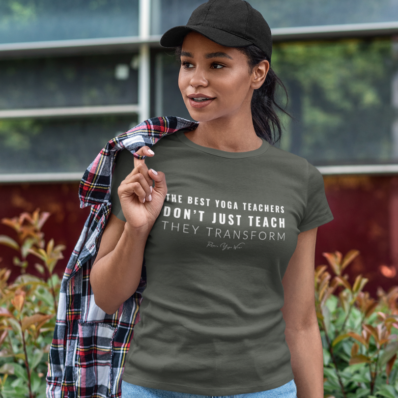Woman wearing Transform Military Green yoga teacher gift tee outdoors in a city garden — Yoga Teacher Gifts collection by Ramro Yoga Wear
