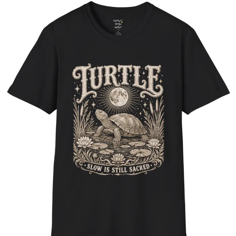 Turtle T-Shirt flat lay with a turtle resting beneath a full moon among lily pads and reeds by calm rippling water — vintage engraved graphic tee by Ramro Yoga Wear in Black.