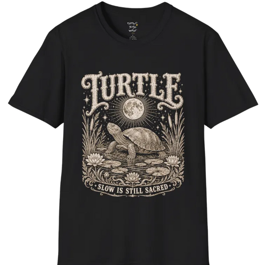 Turtle T-Shirt flat lay with a turtle resting beneath a full moon among lily pads and reeds by calm rippling water — vintage engraved graphic tee by Ramro Yoga Wear in Black.