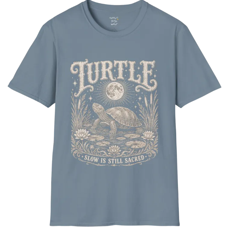 Turtle T-Shirt flat lay with a turtle resting beneath a full moon among lily pads and reeds by calm rippling water — vintage engraved graphic tee by Ramro Yoga Wear in Stone Blue.