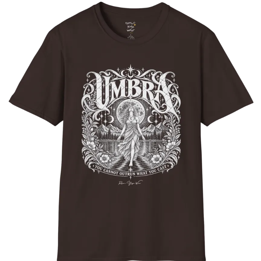 A short sleeved tee called the Umbra T-Shirt, flat lay and a Gildan 64000 shirt. Simply says, You Cannot Outrun What You Cast. Design highlights a moon goddess walking across still water toward distant mountains, framed in ornate vintage lettering with botanical detailing. Color is Dark Chocolate.