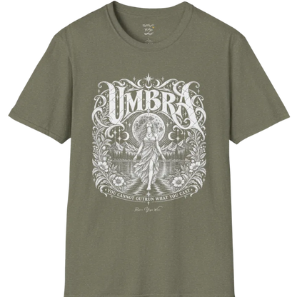 A short sleeved tee called the Umbra T-Shirt, flat lay and a Gildan 64000 shirt. Simply says, You Cannot Outrun What You Cast. Design highlights a moon goddess walking across still water toward distant mountains, framed in ornate vintage lettering with botanical detailing. Color is Heather Military Green.