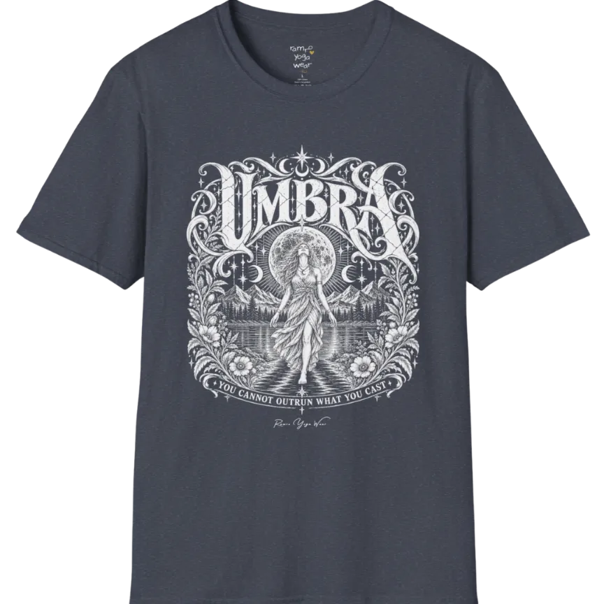 A short sleeved tee called the Umbra T-Shirt, flat lay and a Gildan 64000 shirt. Simply says, You Cannot Outrun What You Cast. Design highlights a moon goddess walking across still water toward distant mountains, framed in ornate vintage lettering with botanical detailing. Color is Heather Navy.