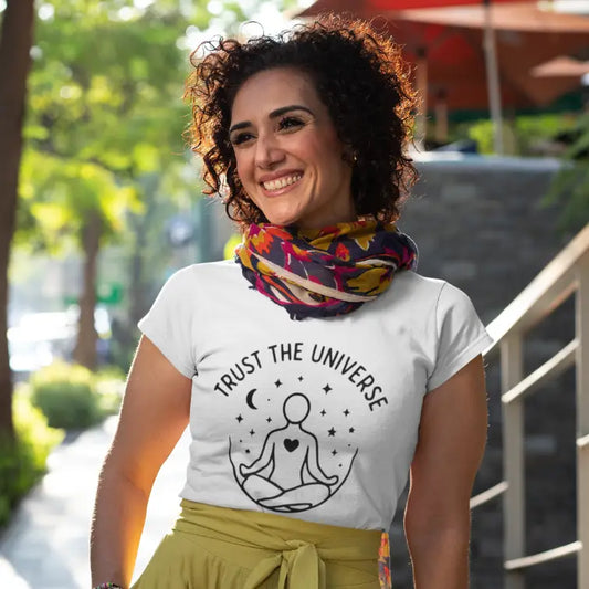 Universe T-Shirt Lifestyle shot featuring woman wearing white tee outdoors. Relaxed yoga lifestyle with calm, confident energy.